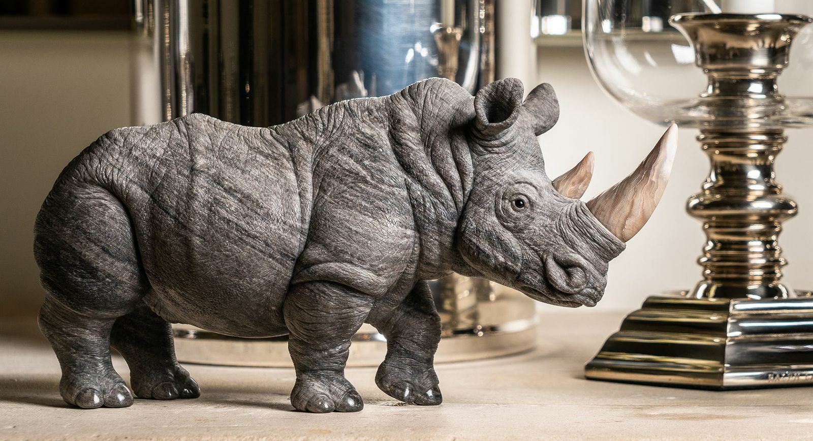 Anna Nova rhinoceros carving in obsidian with petrified wood