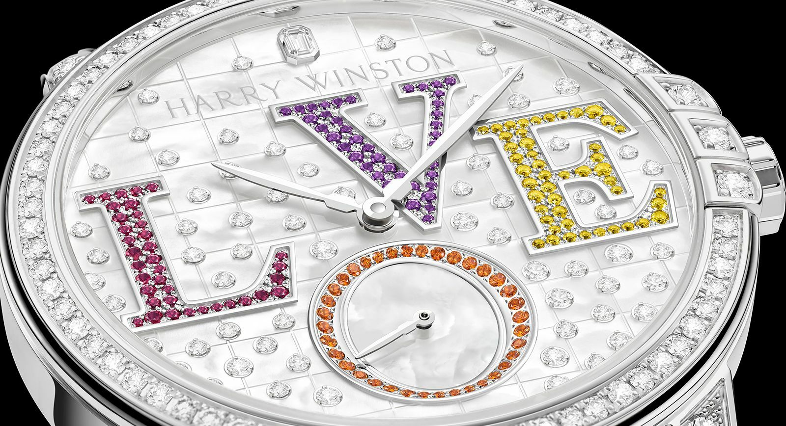Harry Winston Midnight Winston With Love automatic timepiece in white with a beaded mother of pearl dial, 69 brilliant-cut diamonds, 47 yellow sapphires, 42 amethysts, 37 rubies, 36 spessartites, and an emerald-cut diamond