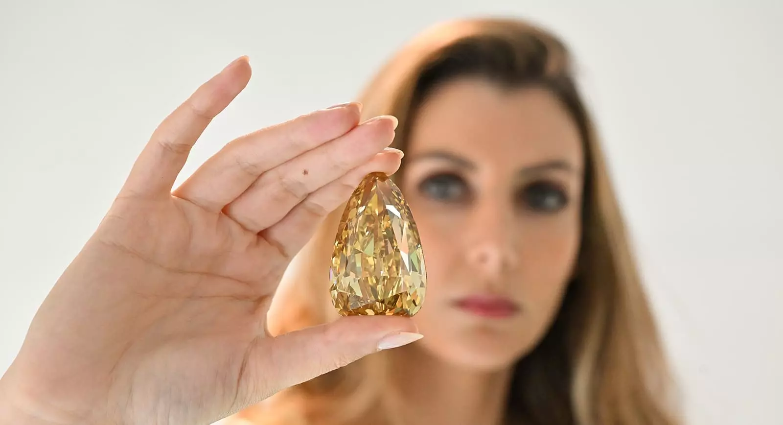 The Golden Canary, a 303.10 carat Fancy Deep Brownish-Yellow Diamond to be auctioned by Sotheby's in New York on Dec 7, pic by Cedric Ribeiro 6 banner