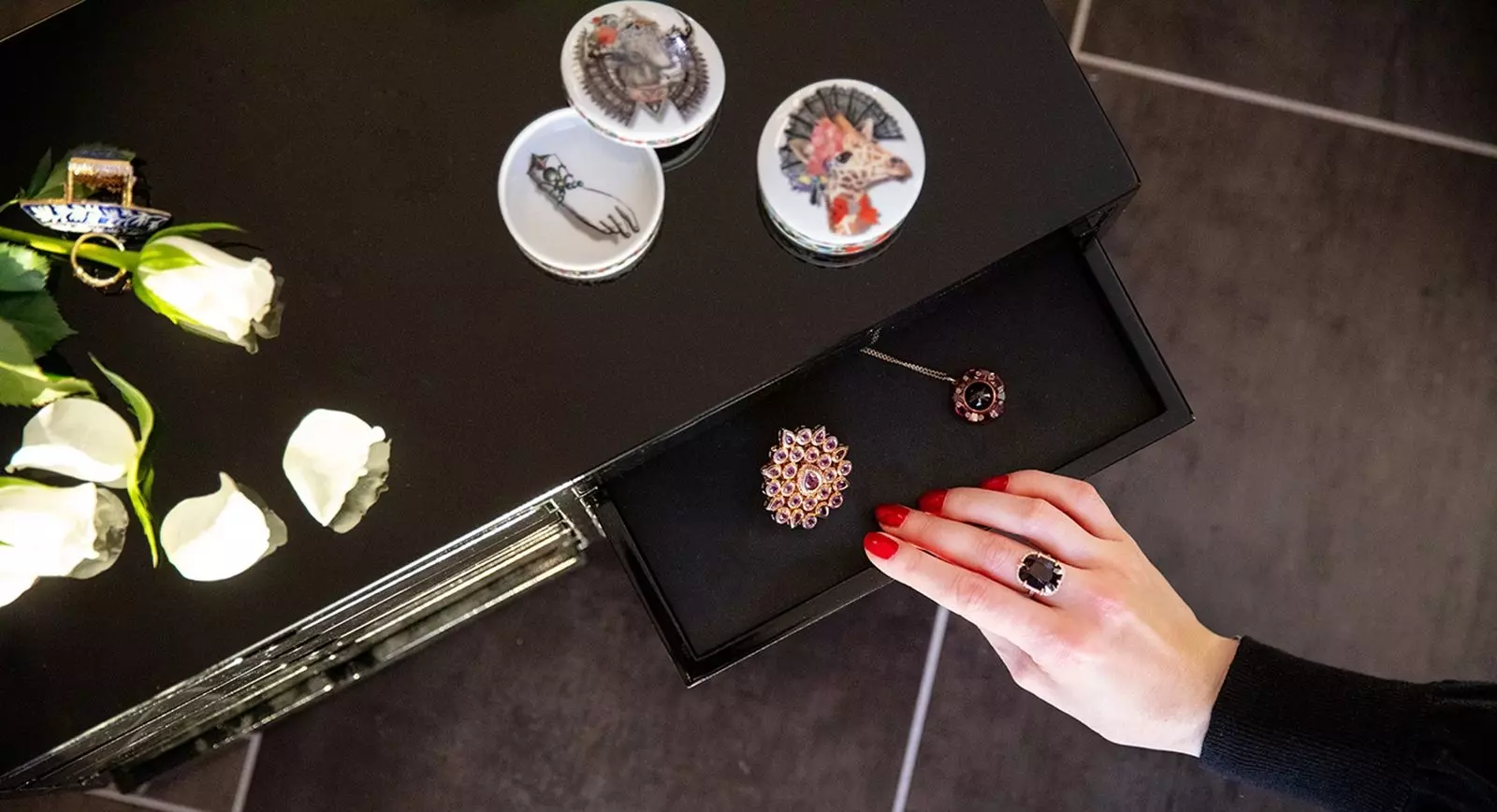 Katerina Perez opens a drawer of luxury jewellery 