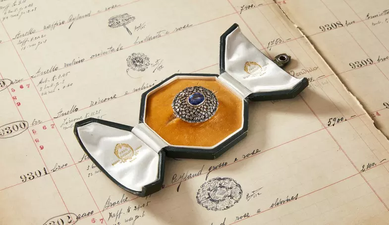 S2x1 brooch with a ramage openwork in silver and yellow gold set with sapphire and diamonds. designed by mario buccellati. handcrafted in the 1940s.jpg