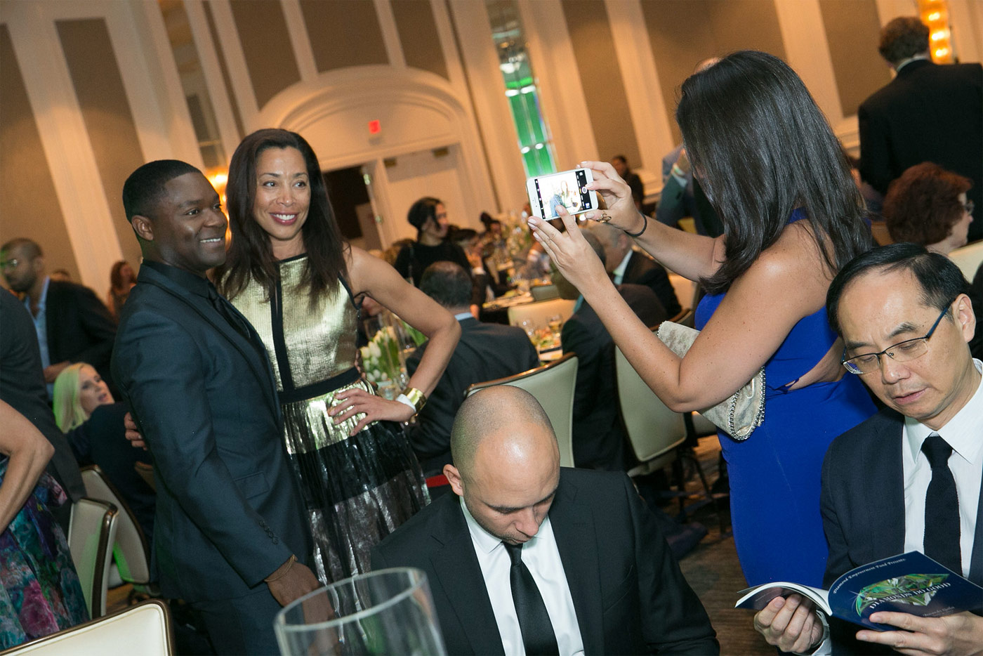  Guests taking their places at the tables during Diamonds Do Good dinner