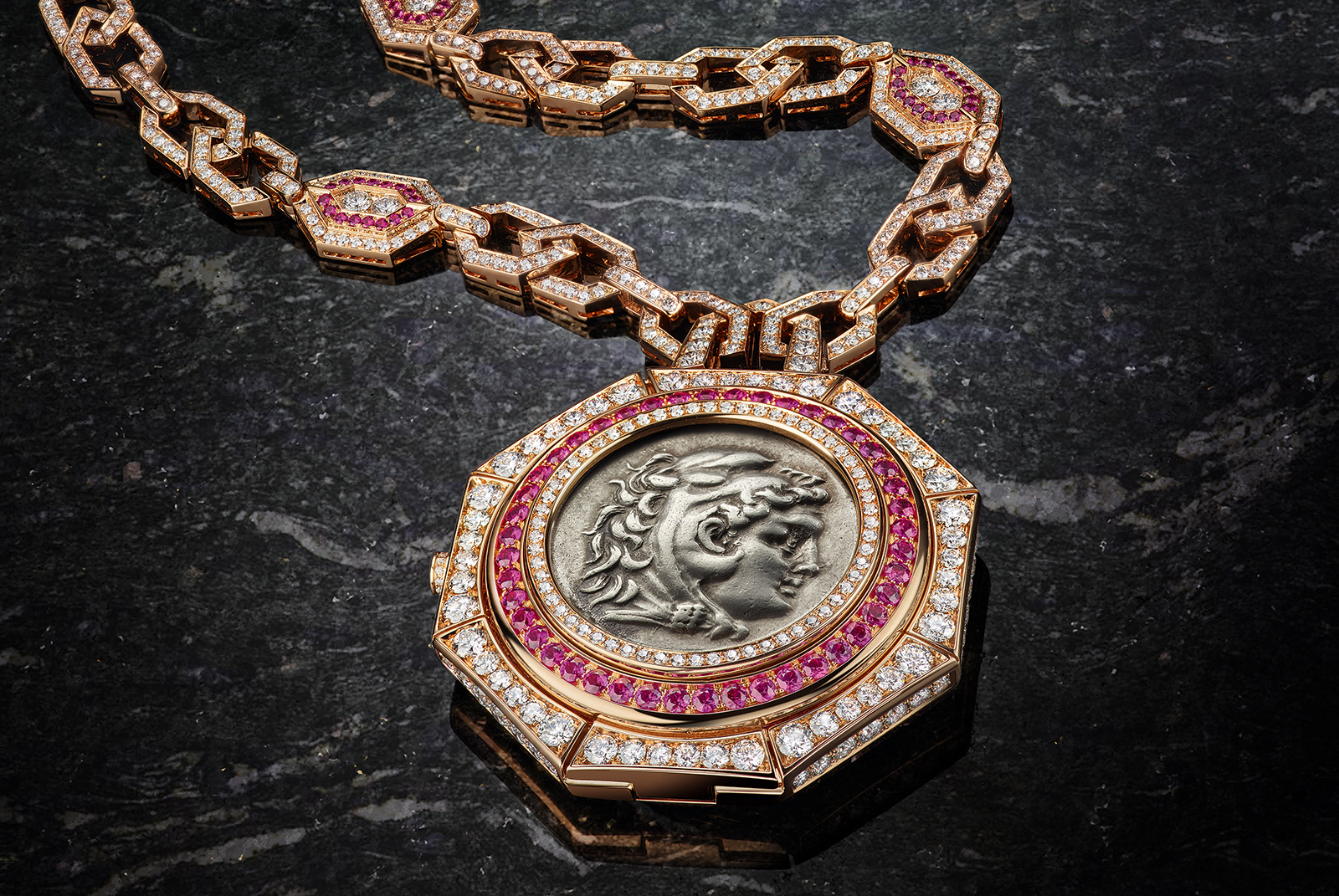  SECRET WATCH MONETE NECKLACE - High Jewellery necklace with secret watch, in pink gold set with 1 silver coin (Macedonia Alexander III, 336-326 B.C.), rubies, diamonds, skeletonized tourbillon lumiere watch with pink gold bridges decorated by hand.