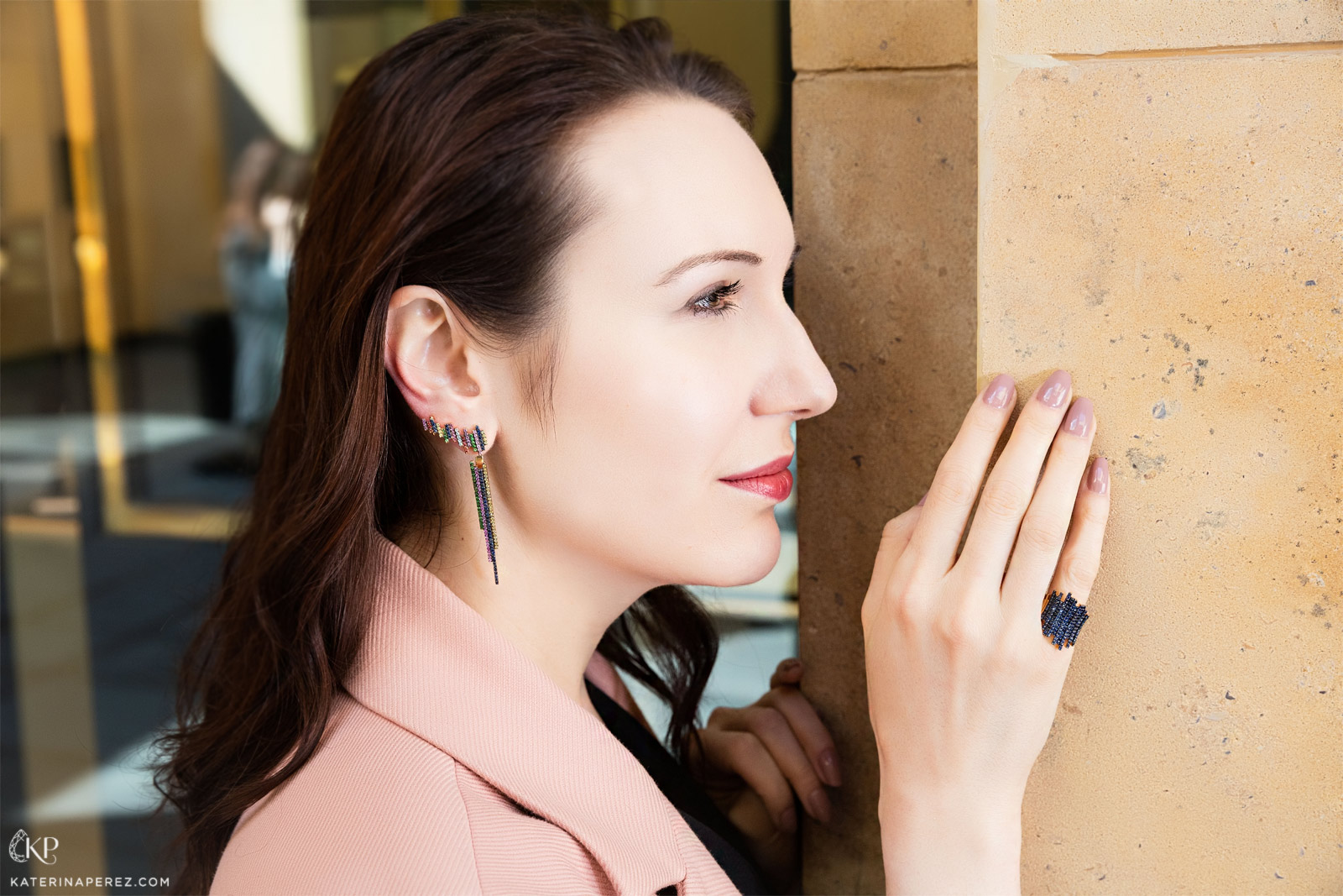 Katerina Perez wearing Nada G ear climbers and a ring with sapphires.  Photo by Simon Martner.