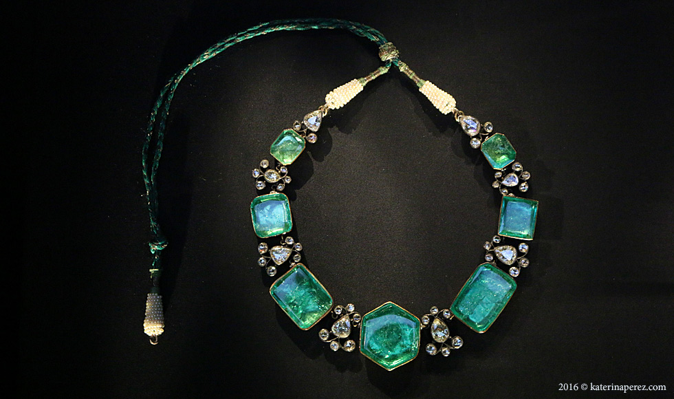  Gold and silver necklace with foiled emeralds and diamonds, the cord ends are wrapped with natural pearls. Probably Hyderabad, c.1900 (?)
