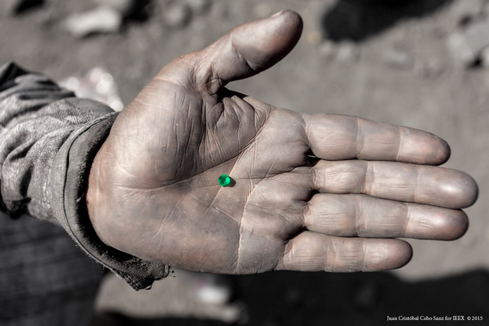   Precious find – a rough emerald. In fact, rubble from the mine is perceived as gift from the mine owners to the local people because it often bears emeralds. Keeping local people happy instead of just exploiting them is very important in order to maintain the balance between the rich and the poor.