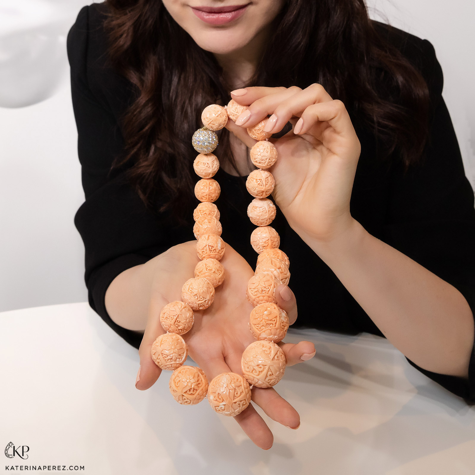 Unique Assael necklace with carved coral. Photo by Simon Martner