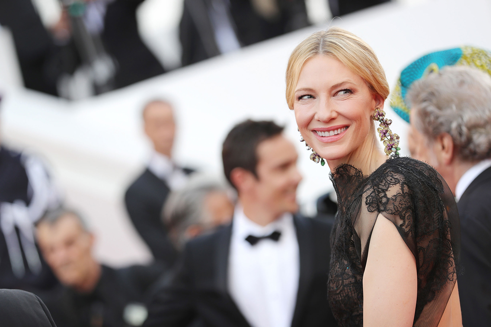  Cate Blanchett wearing Chopard orchid earrings featuring titanium, opals, yellow sapphires, pink sapphires, tsavorites, and garnets