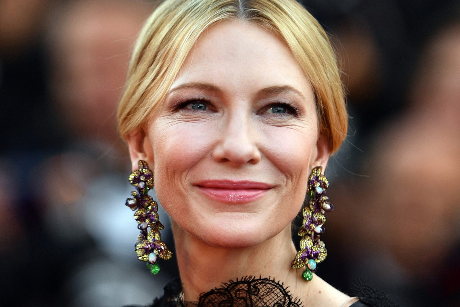 Cate Blanchett wearing Chopard orchid earrings featuring titanium, opals, yellow sapphires, pink sapphires, tsavorites, and garnets