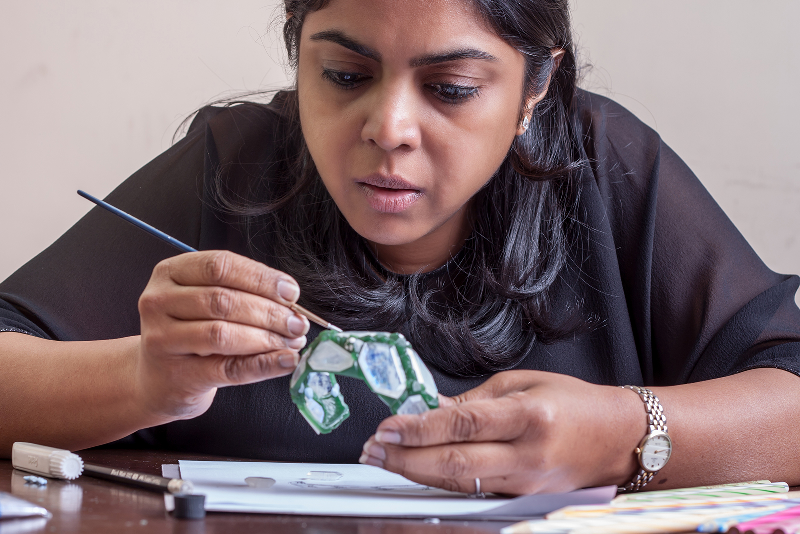Neha Dani working on the 'Aialik' cuff from the 'Glacier' collection wax model
