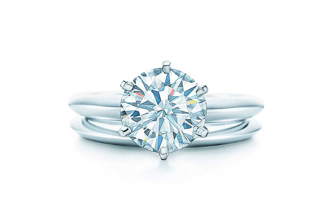  Tiffany & Co. diamond solitaire engagement ring and wedding band 