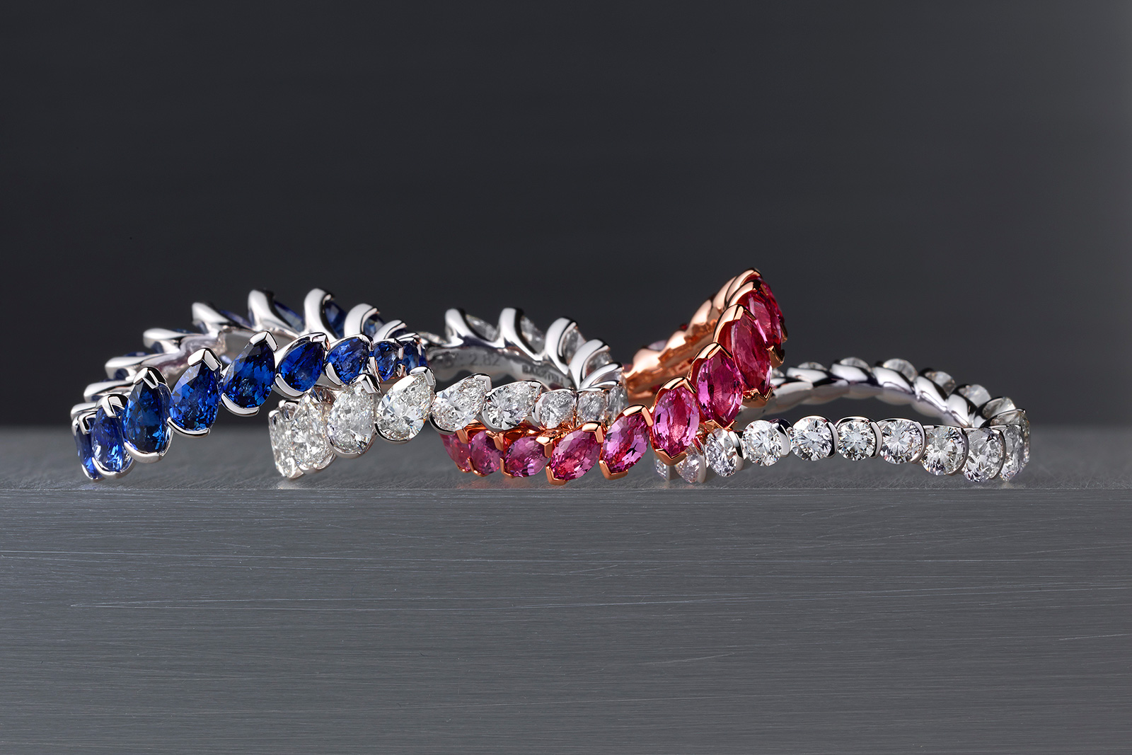 Baenteli 'Cascades' rings in diamonds, pink sapphires and blue sapphires