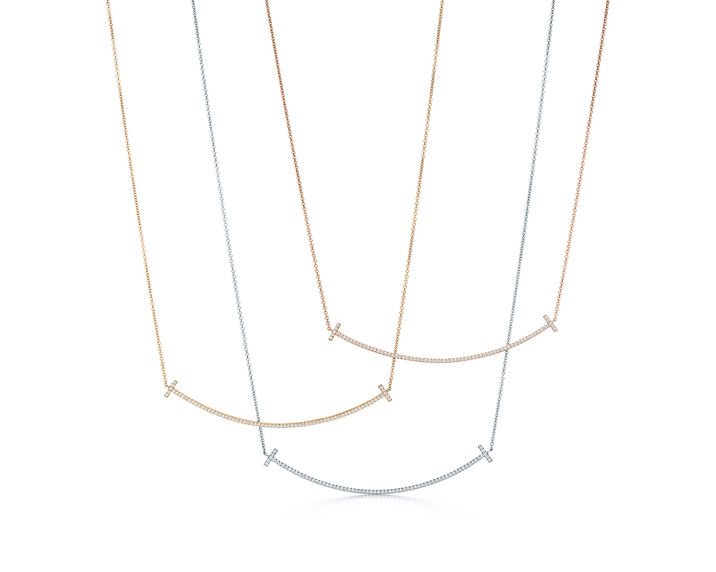 Tiffany & Co. 'T Smile' pendants in white, yellow and rose gold with diamonds