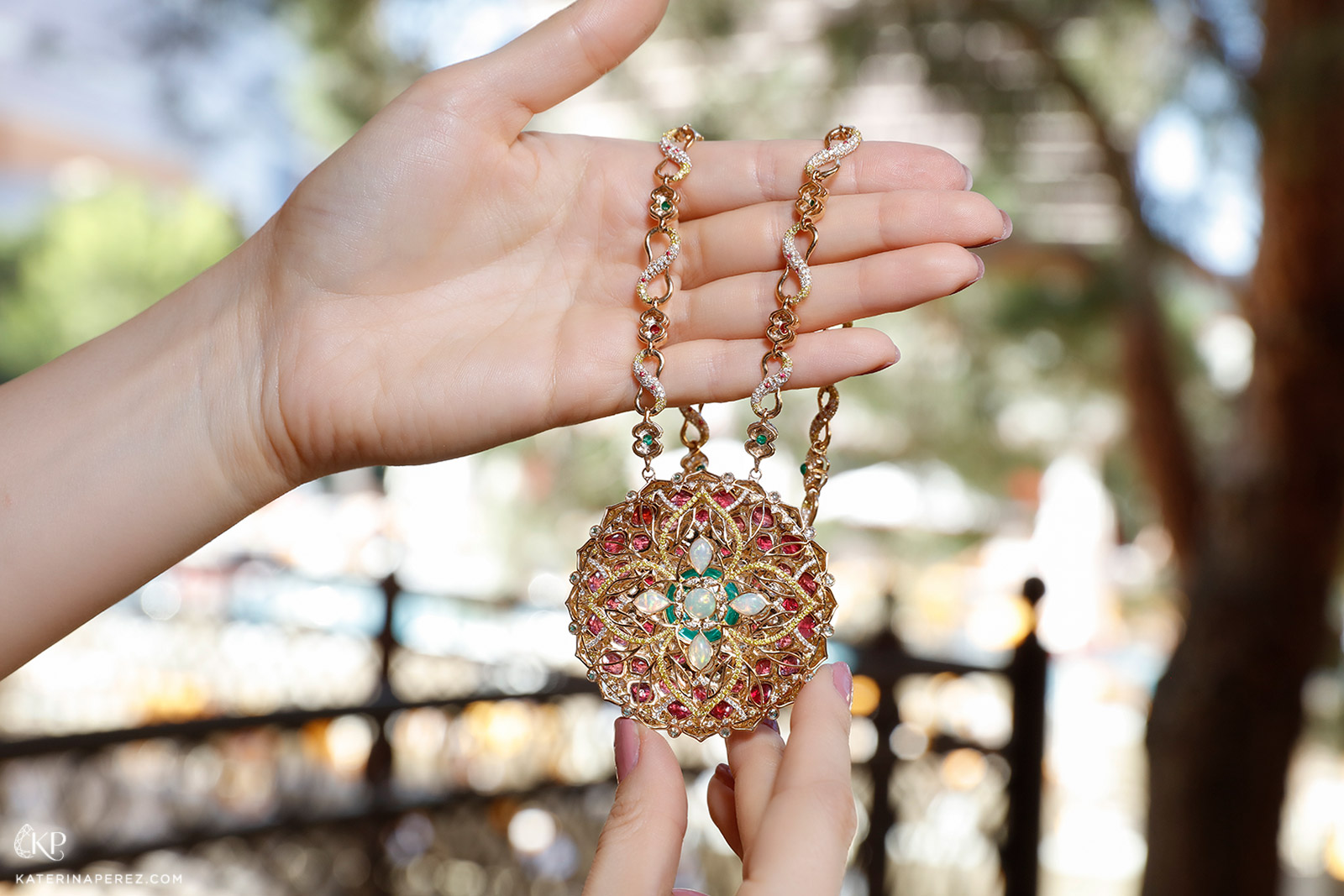 Decorated reverse of Panchoo's medallion necklace in emeralds, spinels and opals