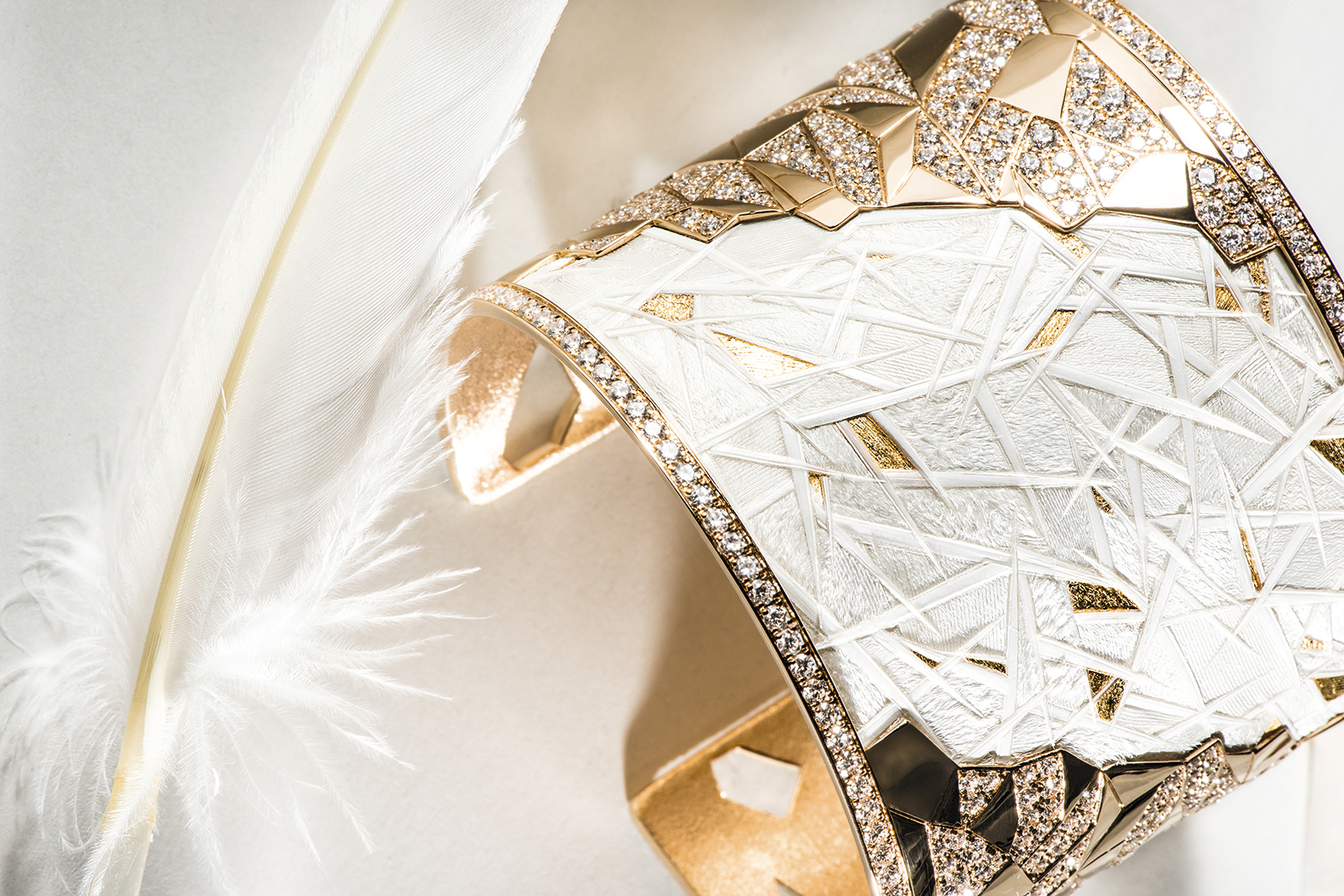 Creation of the Piaget ‘Golden Sunlight’ cuff from the ‘Warming Lights’ line with diamonds and feather marquetry in yellow gold 