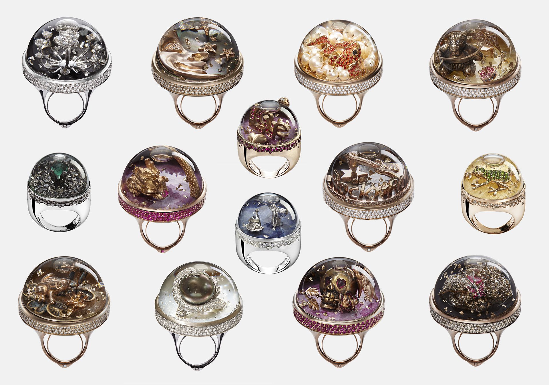 An array of Dreamboule rings, all featuring a sapphire glass dome filled with 'Dream Solution' and paillettes d'Or or poudre d'Or