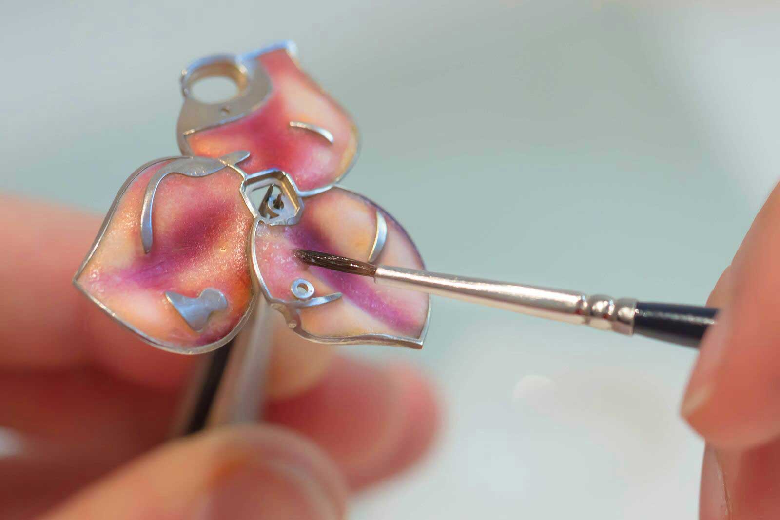  Making of the Jewellery Orchestra ‘Boa Constrictor' dis-engagement ring with 4 ct Colombian emerald, aquamarine, tsavorites, rubies, colourless and black diamonds and enamel in platinum, 18k yellow, pink and white gold