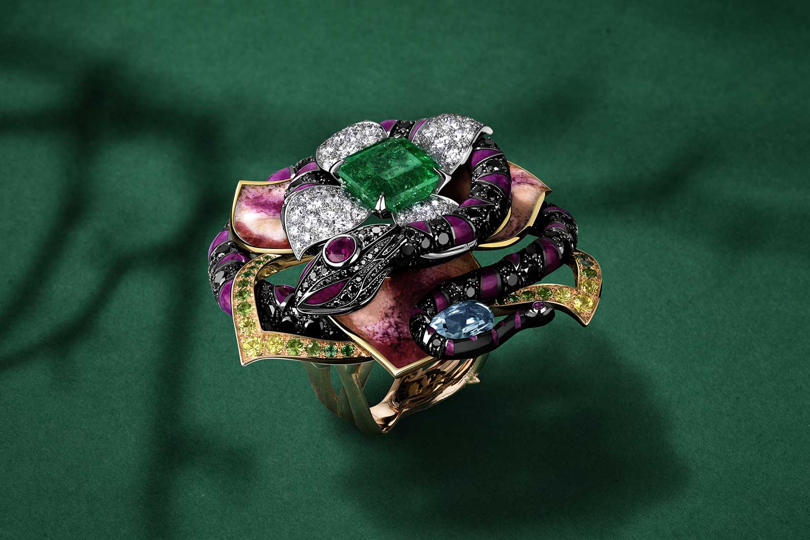 Jewellery Orchestra ‘Boa Constrictor' dis-engagement ring with 4 ct Colombian emerald, aquamarine, tsavorites, rubies, colourless and black diamonds and enamel in platinum, 18k yellow, pink and white gold