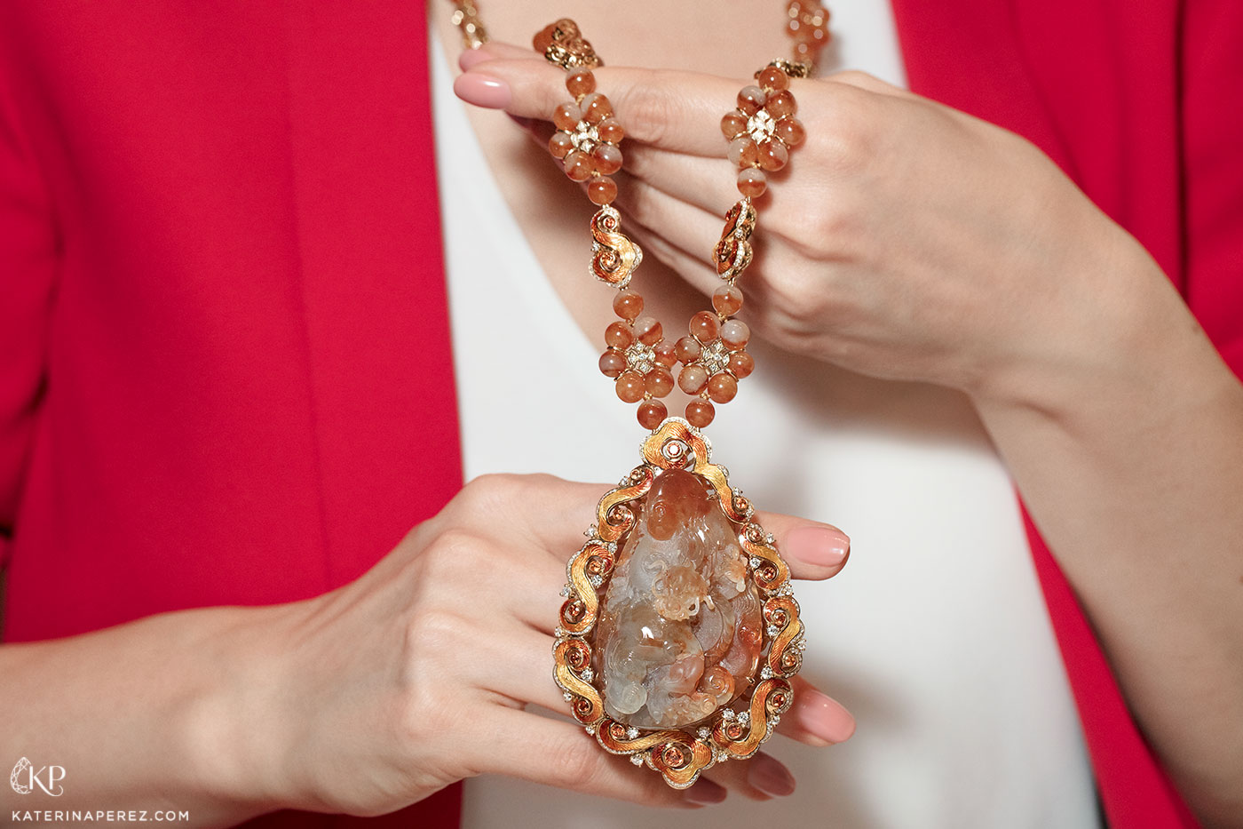 DAWN jewellery necklace with carved orange jade, orange jade beads, sapphires and diamonds in guilloché enamel and 18k red gold