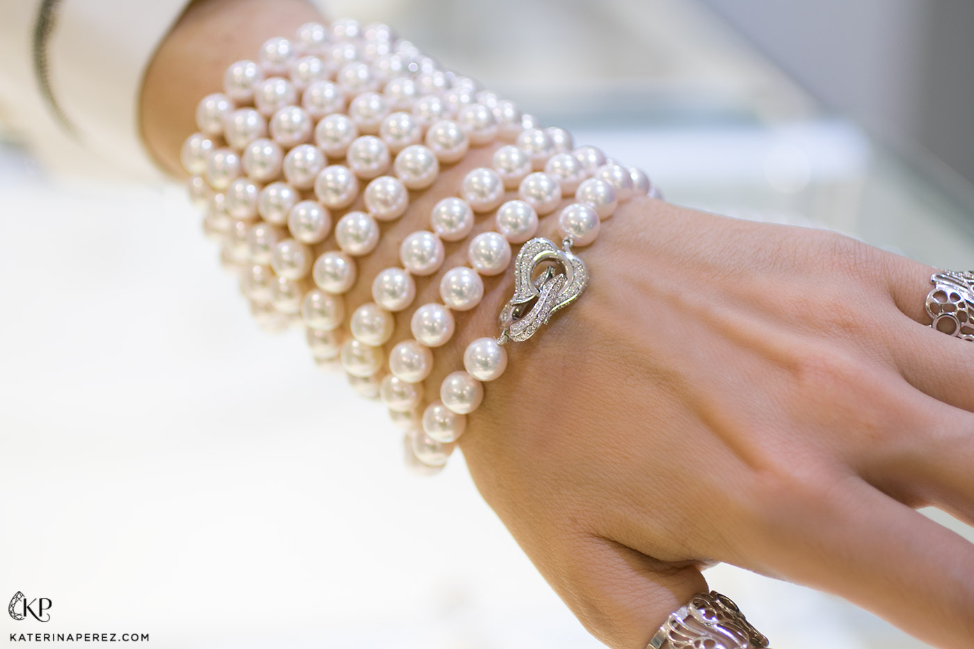 Ksenia Podnebesnaya pearl sautoir necklace with diamond clasp worn as a bracelet