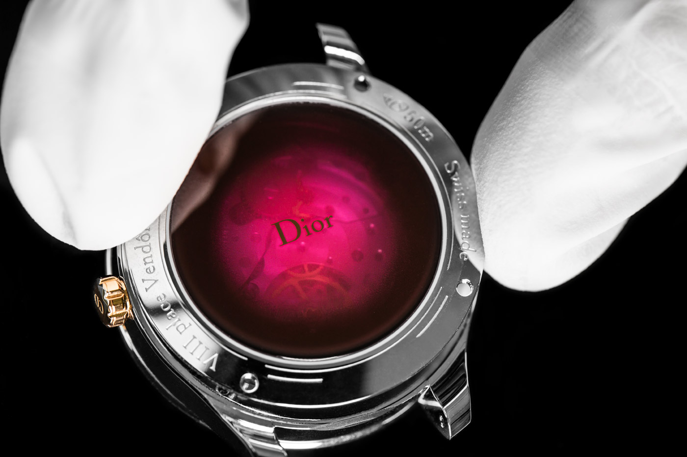  The reverse of the Dior ‘Miss Dior’ watch from the ‘Grand Bal’ collection with diamonds, lacquer, ceramic and 18k rose gold, and the ‘Dior Inversé 11 ½’ calibre automatic movement, displaying the pink coloured sapphire crystal