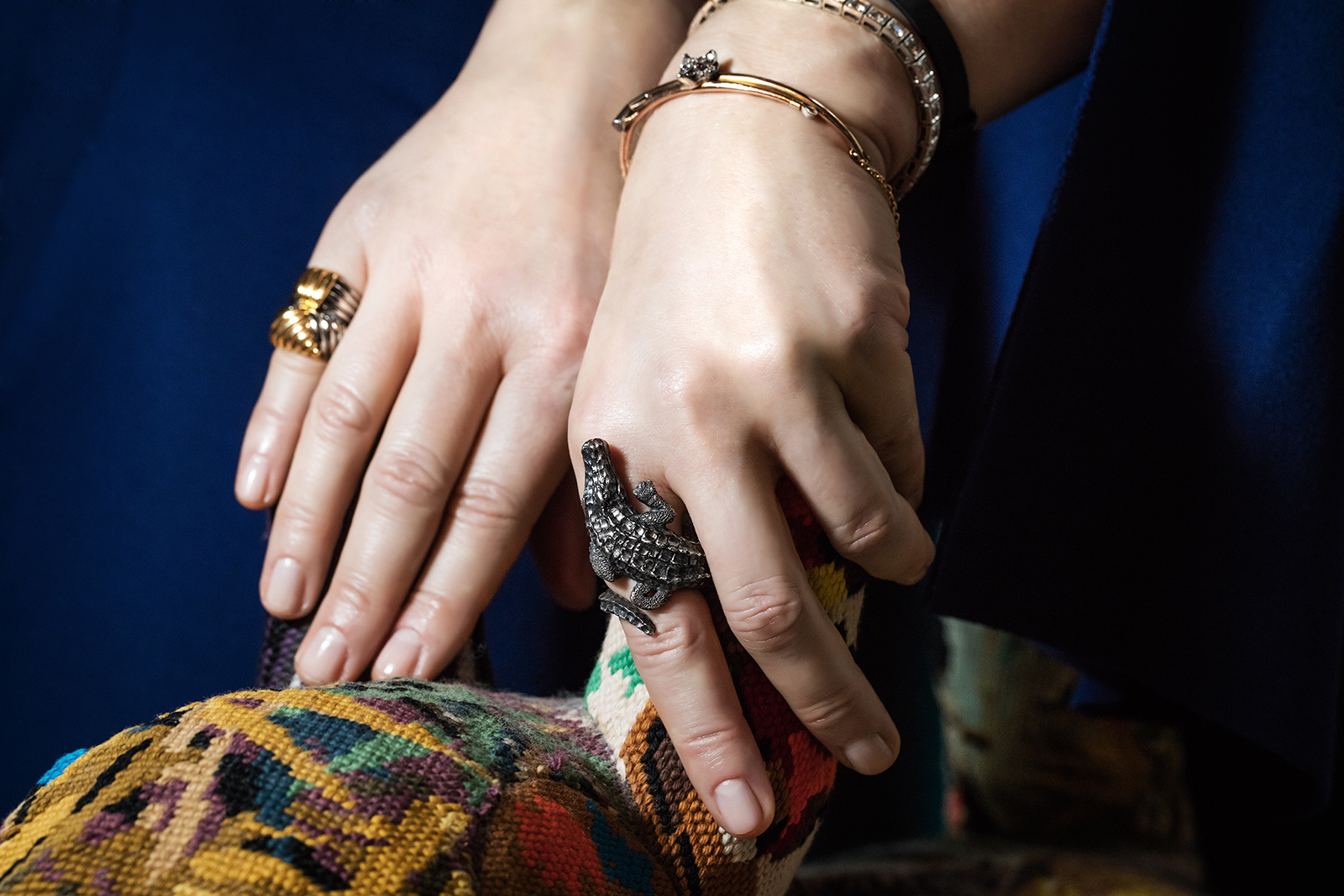A selection of Second Pétale jewellery including (from left to right) Van Cleef&Arpels rings in 18k yellow gold and steel, crocodile ring in silver, and fox bangle with diamonds and rubies in 9k yellow gold and silver