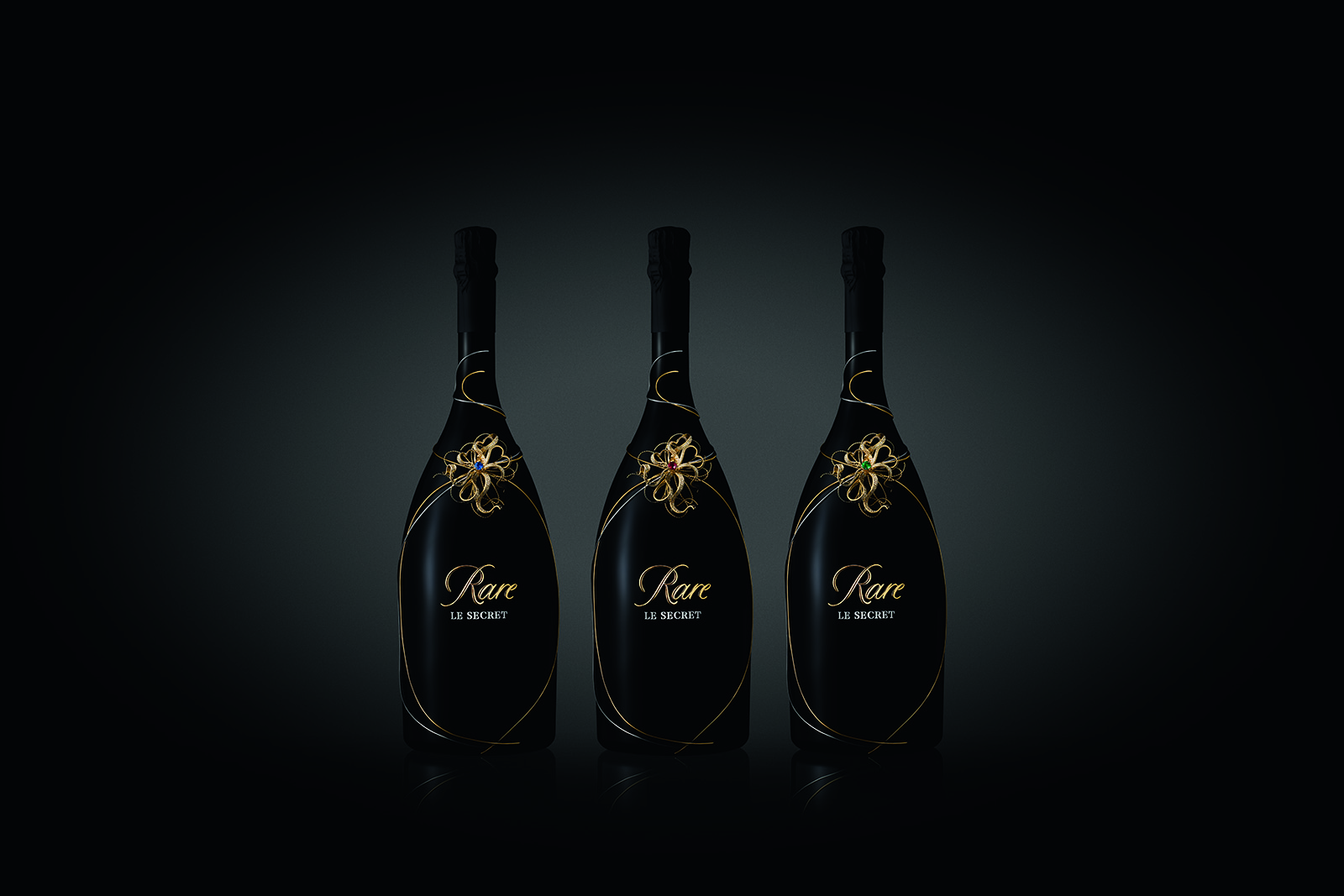 Mellerio dits Meller and Piper Heidsieck collaboration ‘Le Secret Rare’ prestige cuvée bottles with 1.15ct ruby, emerald and sapphire accented with diamonds in yellow gold and platinum