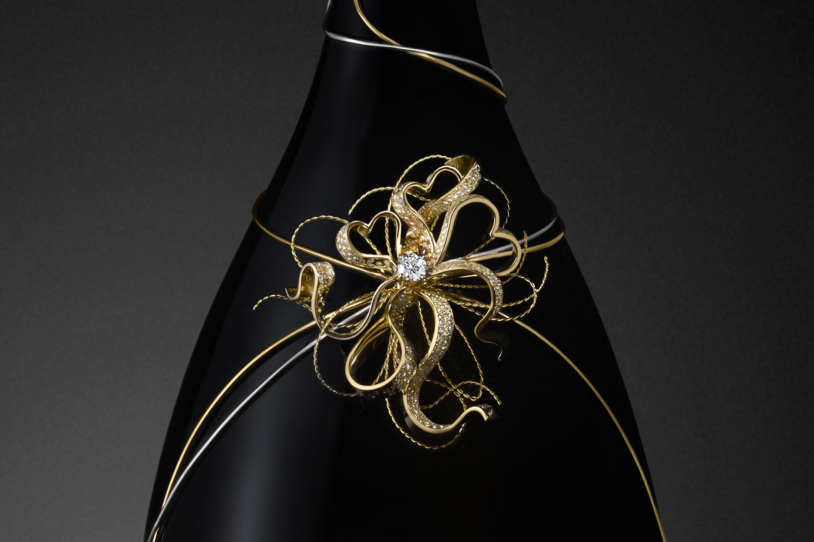  Mellerio dits Meller and Piper Heidsieck collaboration ‘Le Secret Rare’ prestige cuvée bottles with 1.15ct diamond accented with diamonds  in yellow gold and platinum