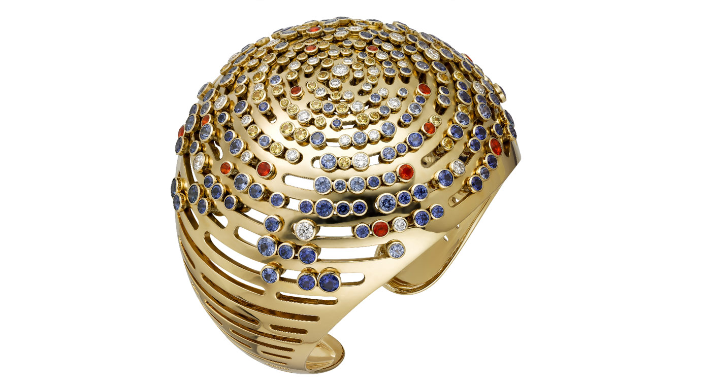 Cartier 'Lights of the Earth' cuff from the 'Les Galaxies de Cartier' collection with yellow and blue sapphires, fire opals and diamonds in 18k yellow gold