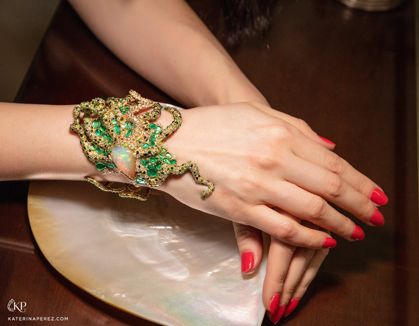  Masterstrokes 'The Charm of Eight Arms' cuff with 14.97ct opal and 10.19ct emeralds, diamonds and champlevé  enamel in 18k yellow gold