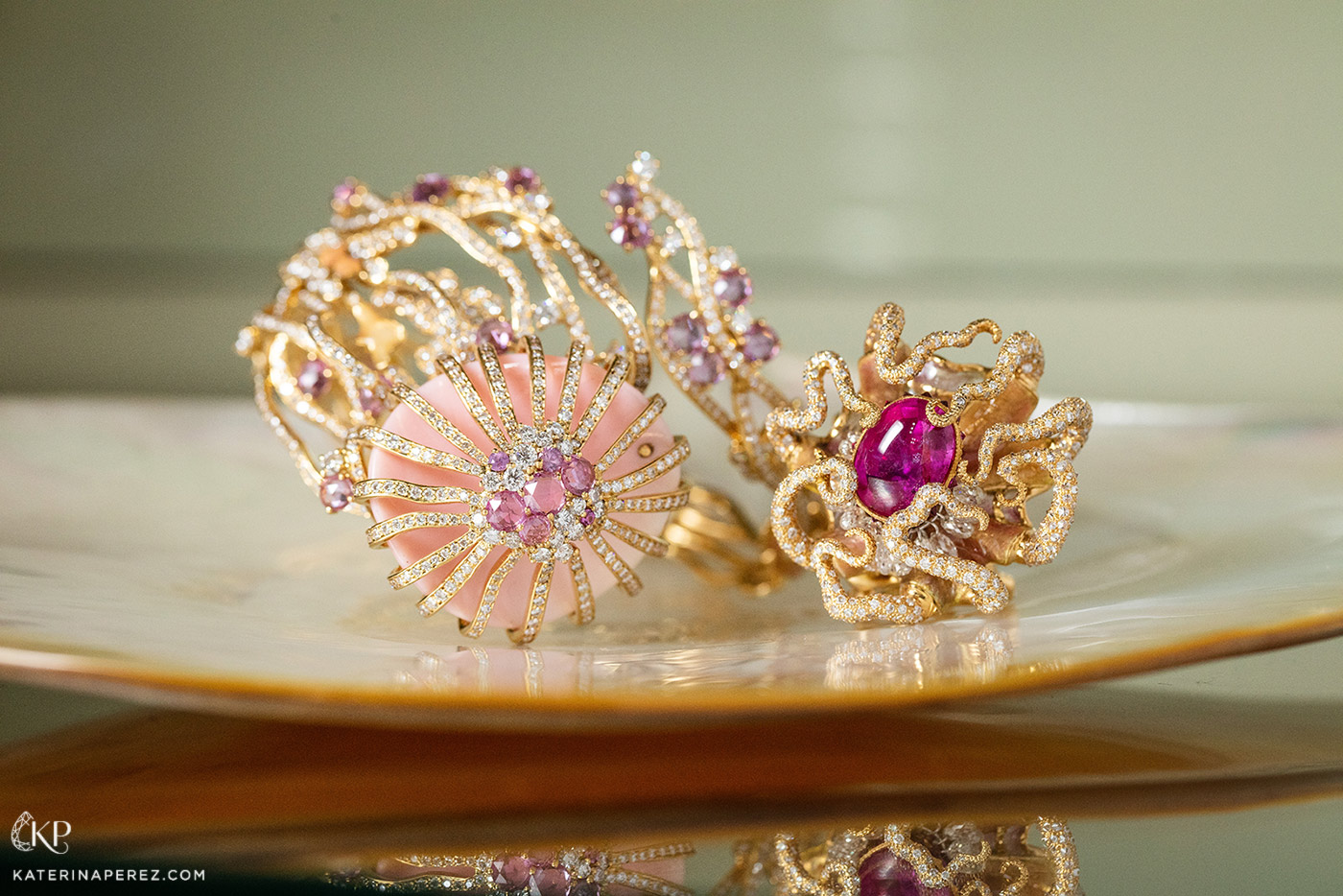  Masterstrokes ‘Basic Instinct’ cuff from the ‘Sixth Sense’ collection with 25.01ct conch shell, 5.72ct pink sapphires, diamonds in champlevé enamel, and ‘The Uno’ ring from ‘Charm of Eight Arms’ collection with 5.99ct GRS certified ruby and diamonds in bassetaille and plique-a-jour enamel, both in 18k yellow gold