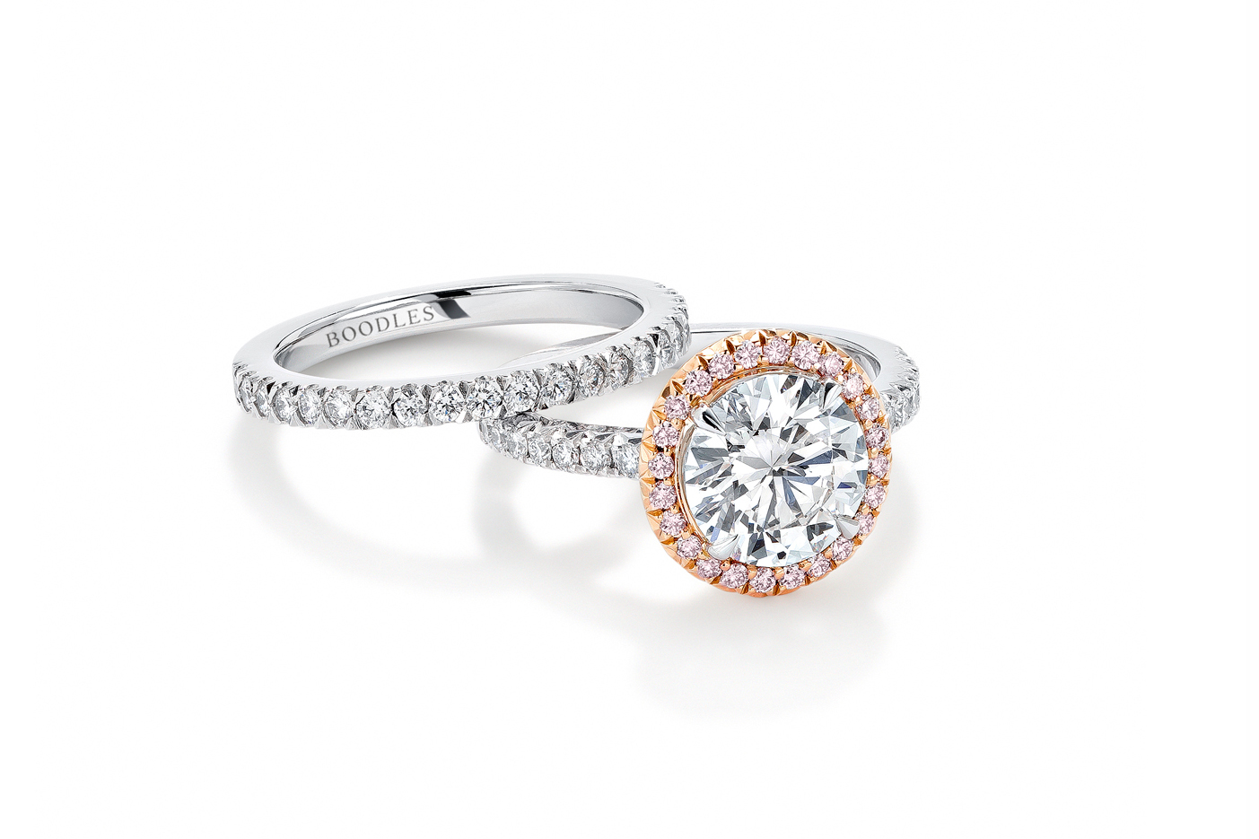  Boodles ‘Vintage' engagement and wedding ring set, with brilliant cut feature diamond and accenting pavé diamonds in white and rose gold