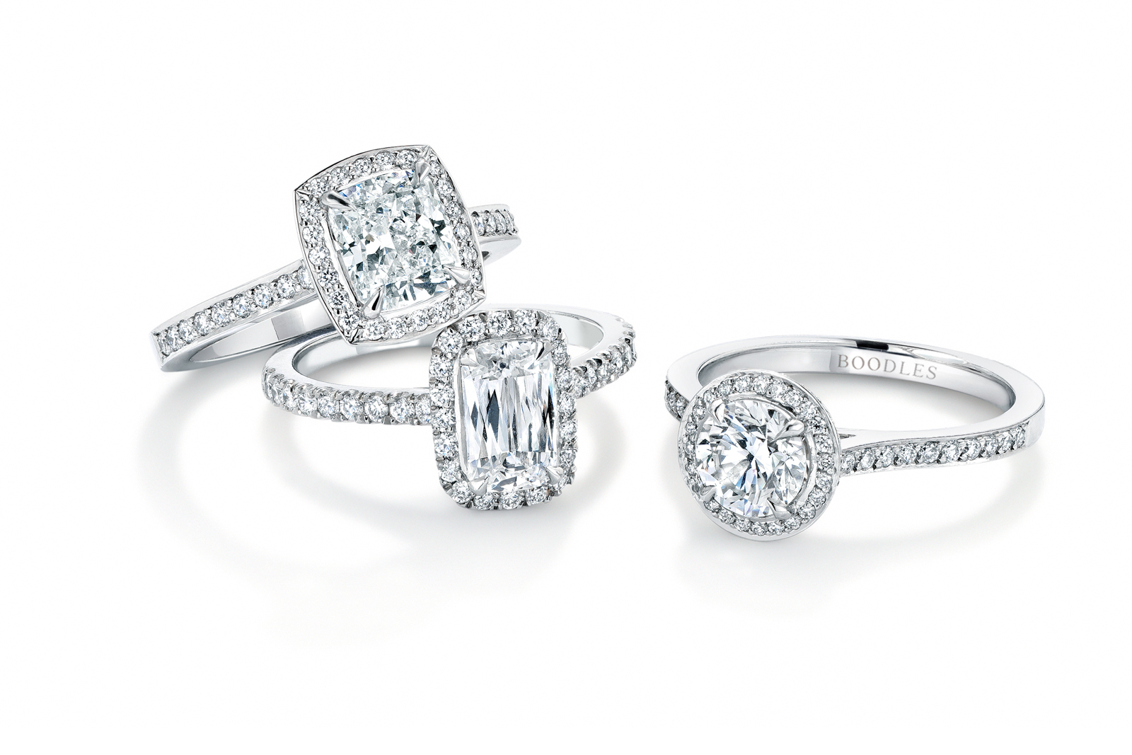 Boodles ‘Vintage’ collection halo engagement rings with cushion, brilliant and Ashoka cut central diamonds in white gold