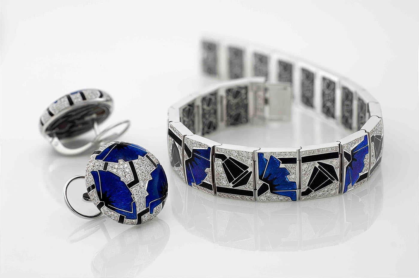  'Poppy' earrings and a bracelet by Ilgiz F decorated with enamel and diamonds set in white gold
