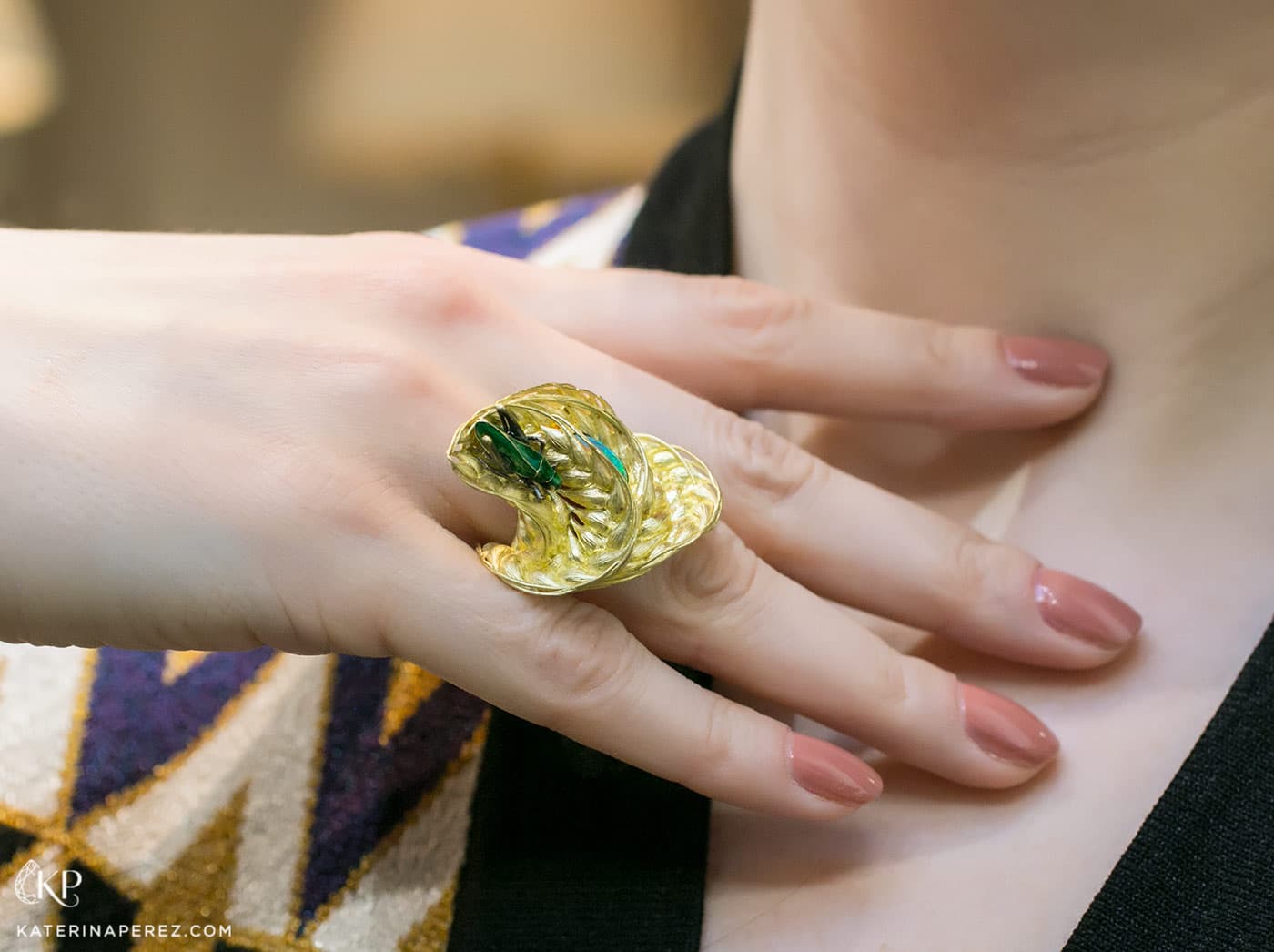'Wind in a field' ring by Ilgiz.F made in sculptured yellow gold with enamelled grasshopper and an oval opal