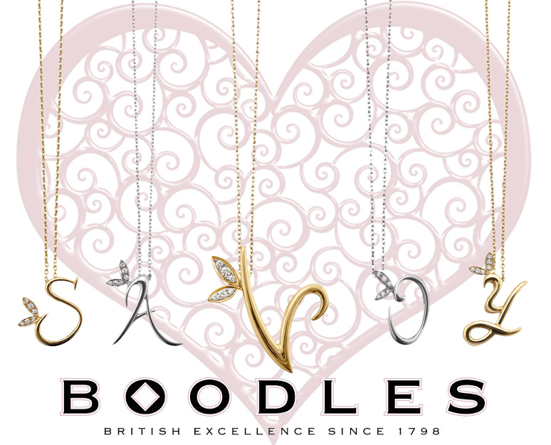 Boodles love letters in yellow and white gold with diamonds