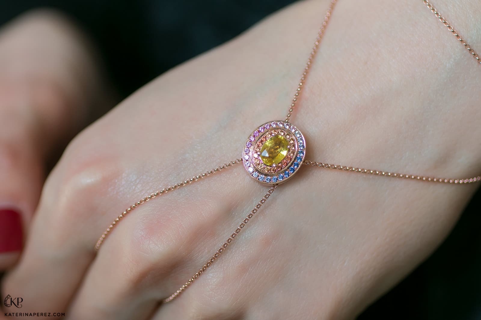  Alice Van Cal's adaptable 'Alice Eclipse' jewel with  1.15ct yellow sapphire and multi-coloured sapphires in 18k rose gold