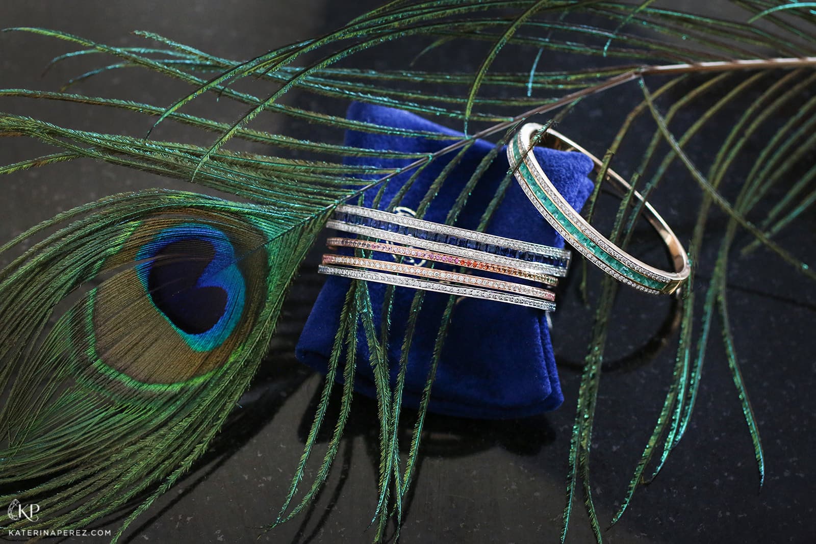  Alice Van Cal 'Union' and 'Journey' bangles with (from top to bottom) emeralds, blue sapphires, or multi-coloured sapphires, all with diamonds in 18k white or rose gold