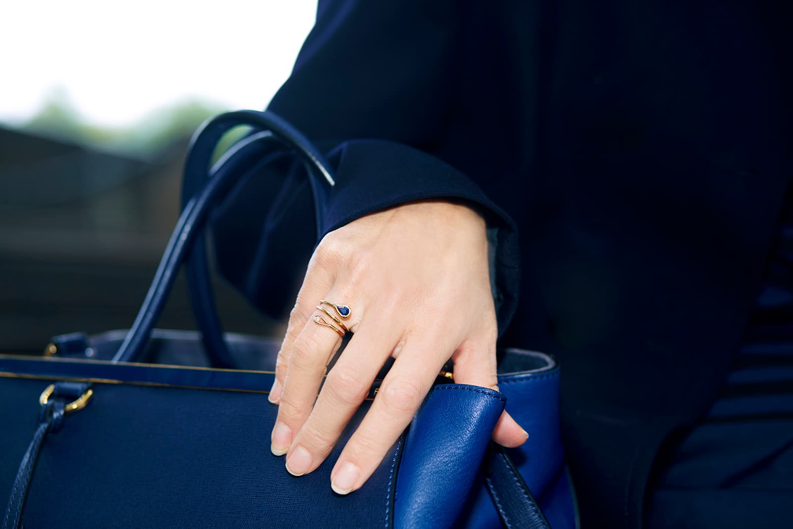 Maria Canale 'Drop' collection twist ring with sapphire and diamond in 18k yellow gold