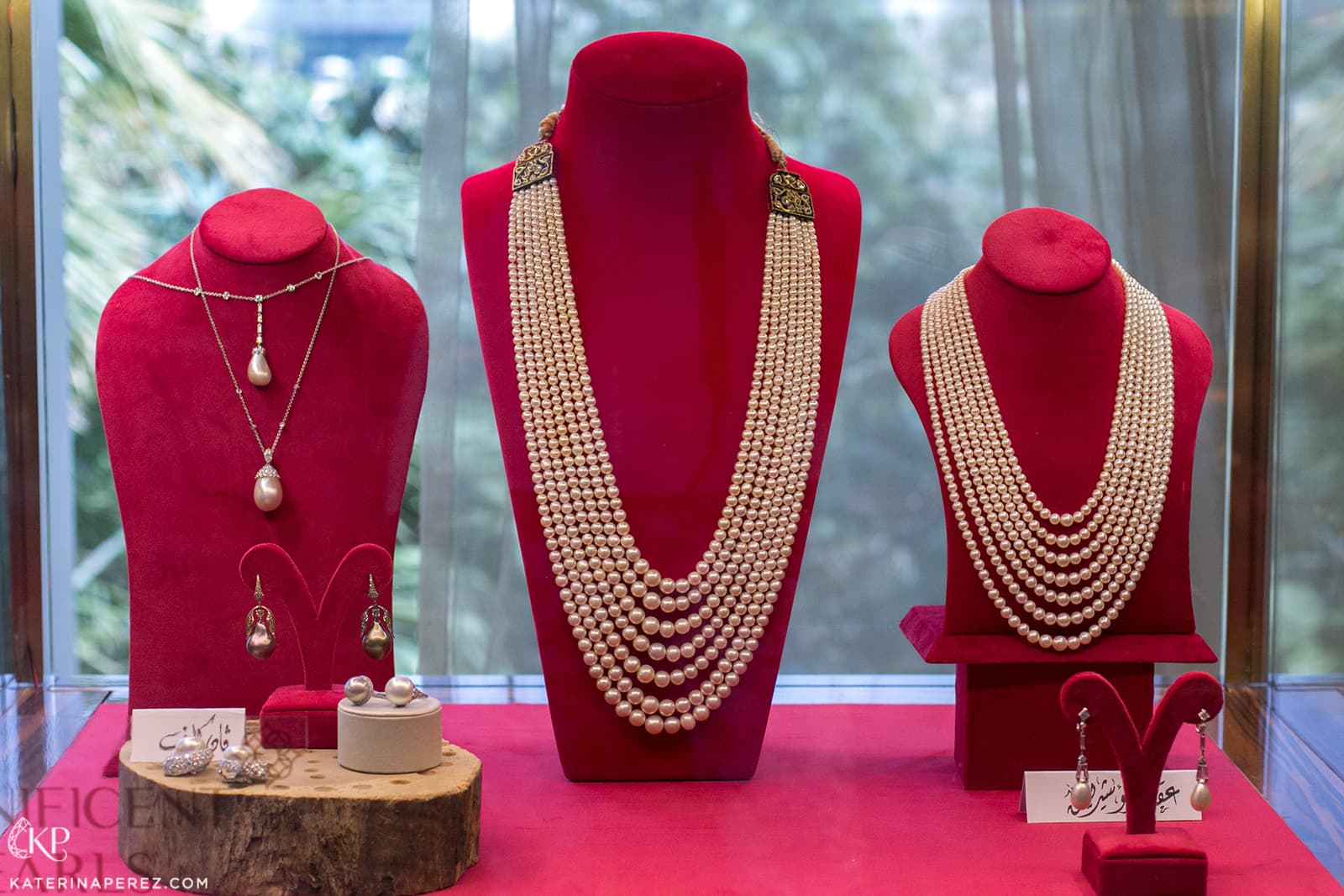 Christie's Magnificent Pearls exhibition showcase with the Rajasthani pearl strings in the middle
