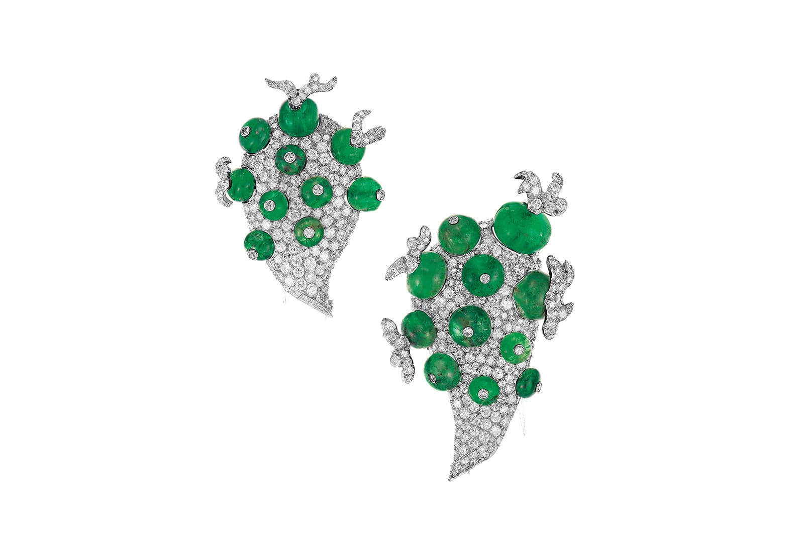  A pair of emerald and diamond clip-brooches by Paul Flato