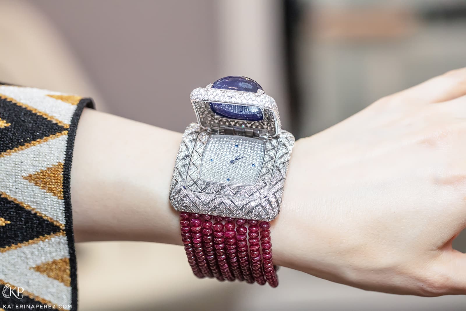  Veschetti secret watch with sugarloaf tanzanite, tanzanite indicators, diamonds and Mozambique ruby beads in 18k white gold