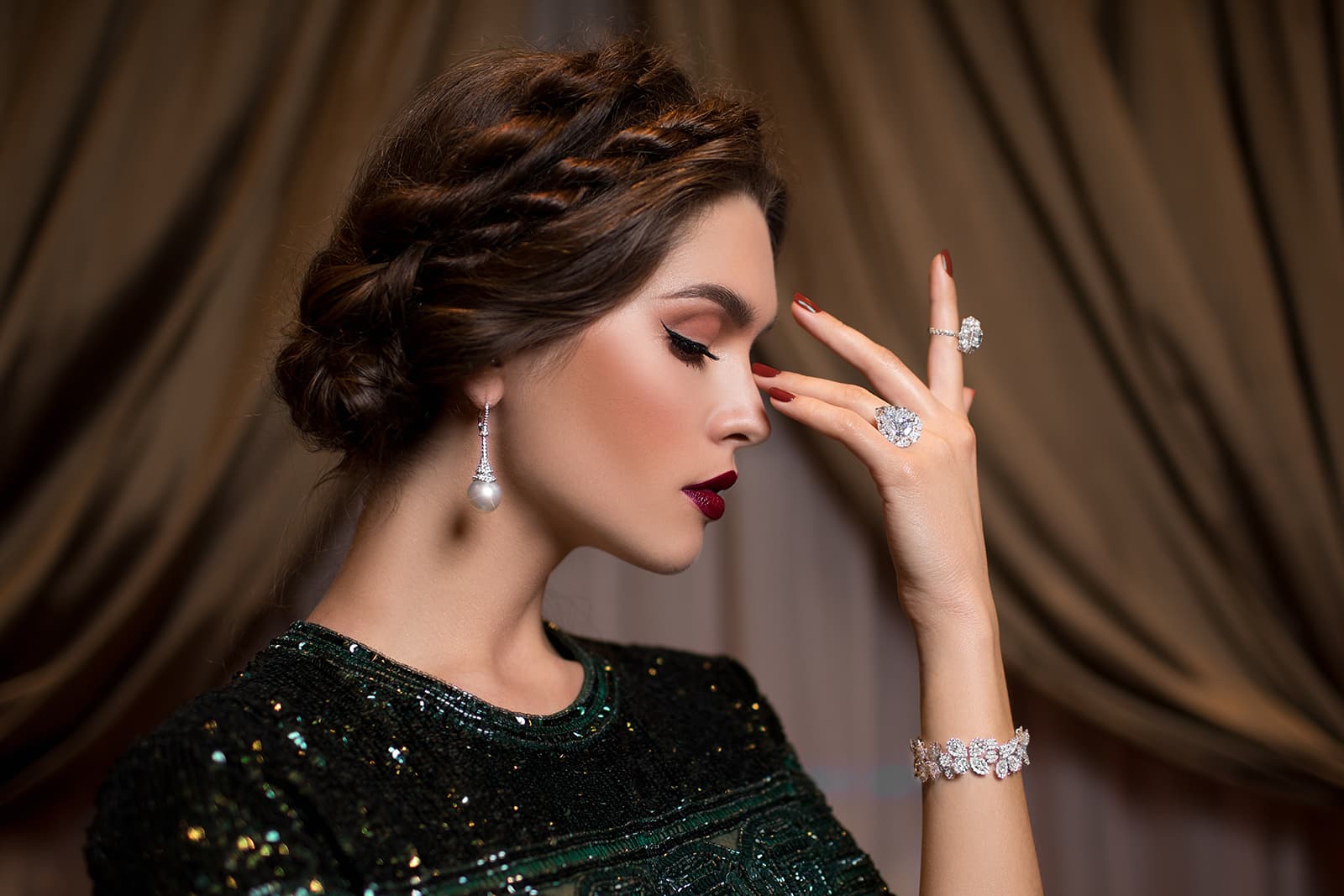 A suite of MaximiliaN London jewellery including a drop earring with pearl, cocktail rings and bracelet, all with diamonds