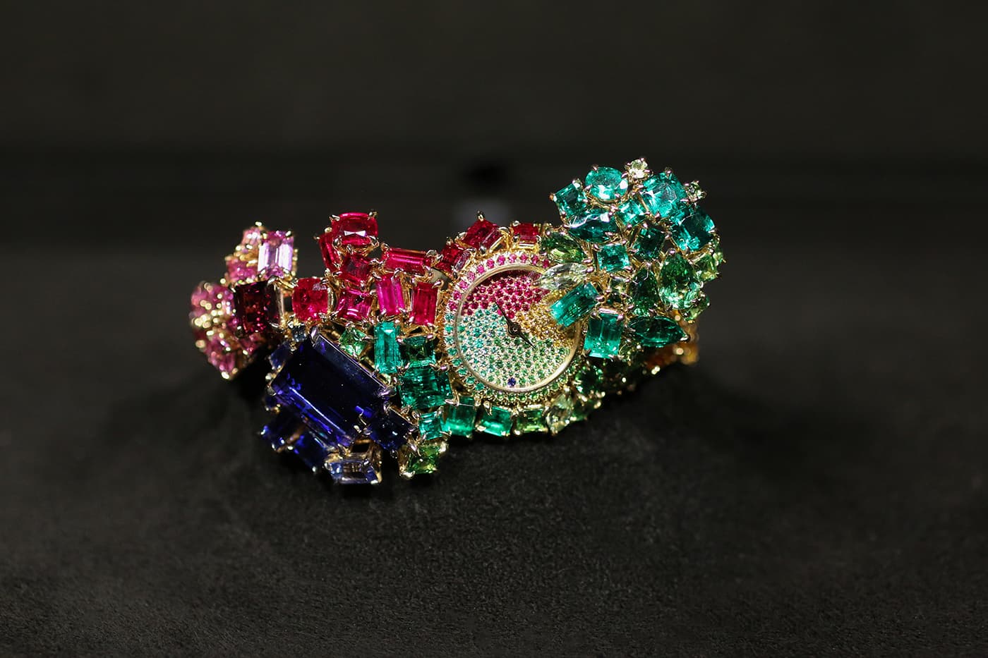 Dior 'Gem Dior' secret watch with emeralds, sapphires, rubies, diamonds and tanzanite in yellow gold
