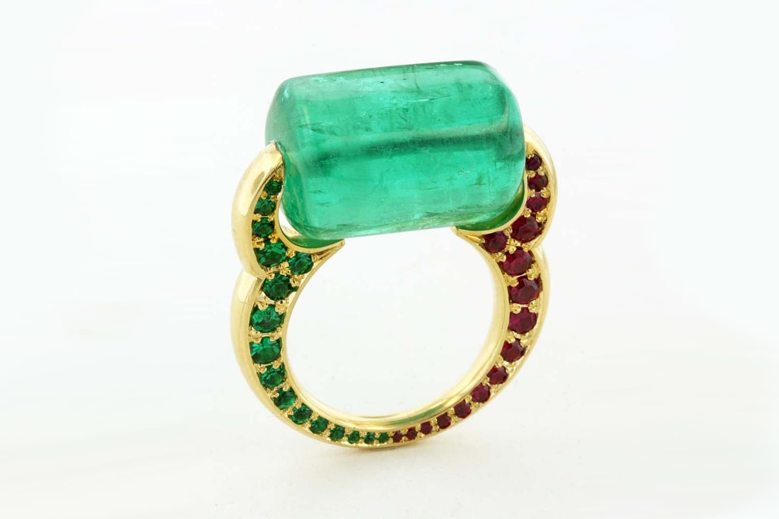 Taffin 'Passage to India' ring with emerald, accenting emeralds and rubies in yellow gold
