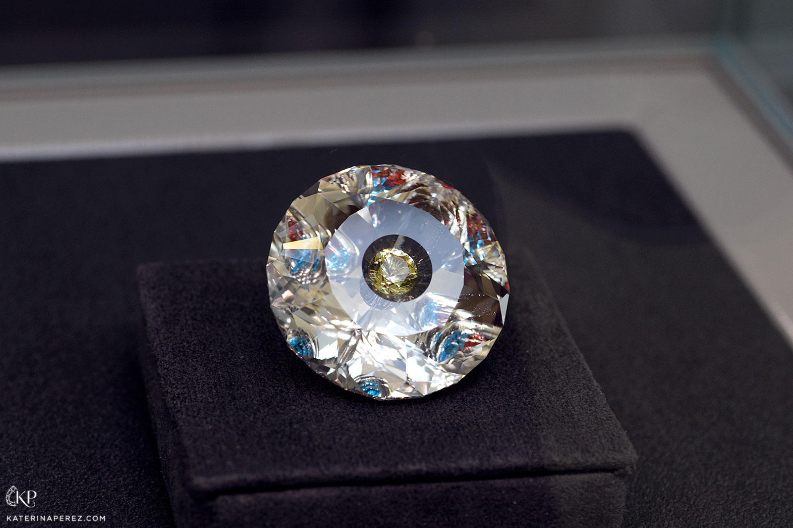 Dmitriy Samorukov '50th Anniversary of the Diamond Fund' composite gemstone. Colourless topaz is used as a based which is further embellished with garnets, blue topaz and heliodor