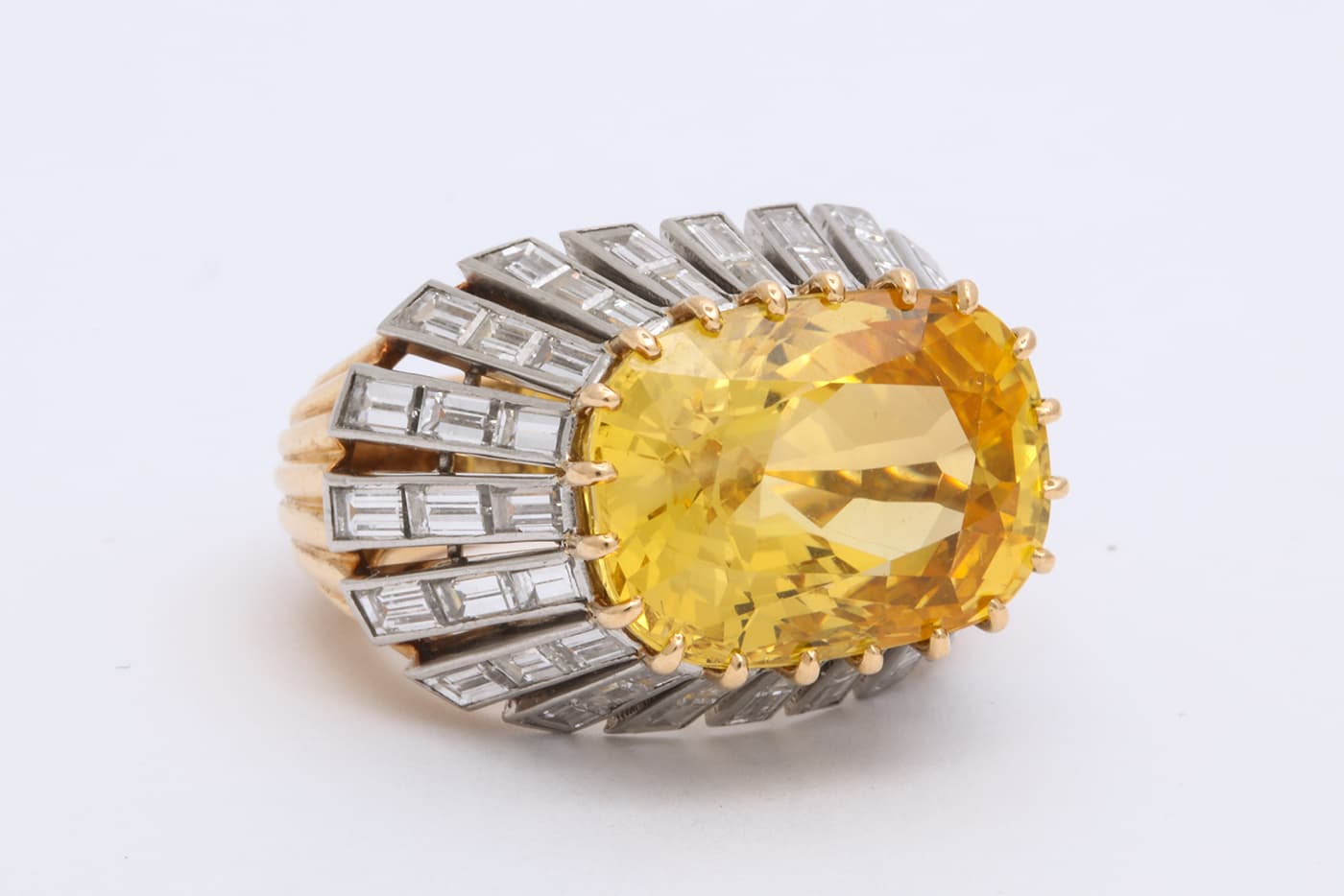  Cartier ring with yellow sapphire and diamonds in white and yellow gold offered by A La Vieille Russie