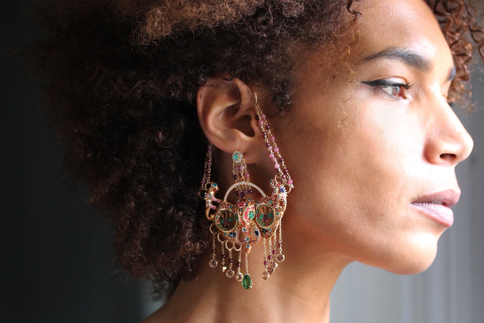  Aude Mathon x Émeline Piot ‘Unique’ collection ‘Gor Orisa-Nla’ solo earring with tourmaline, iolite, rhodolite, Imperial topaz, garnet, aquamarine, emerald, sapphires, diamonds, spinels and enamel in yellow gold