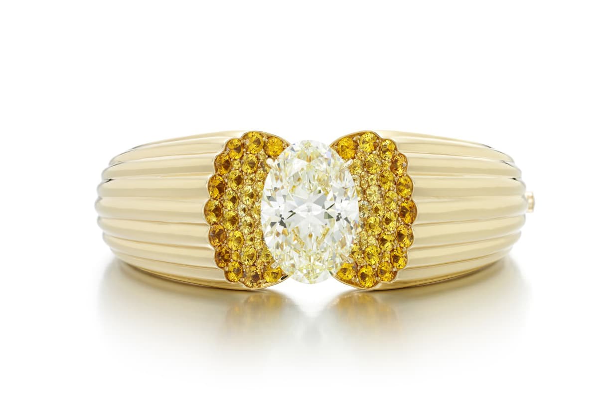 Sotheby’s Diamonds by Lily Gabriella ‘Solar’ cuff with 21.15ct oval cut yellow diamond, colourless and yellow pavé set sapphires in yellow gold