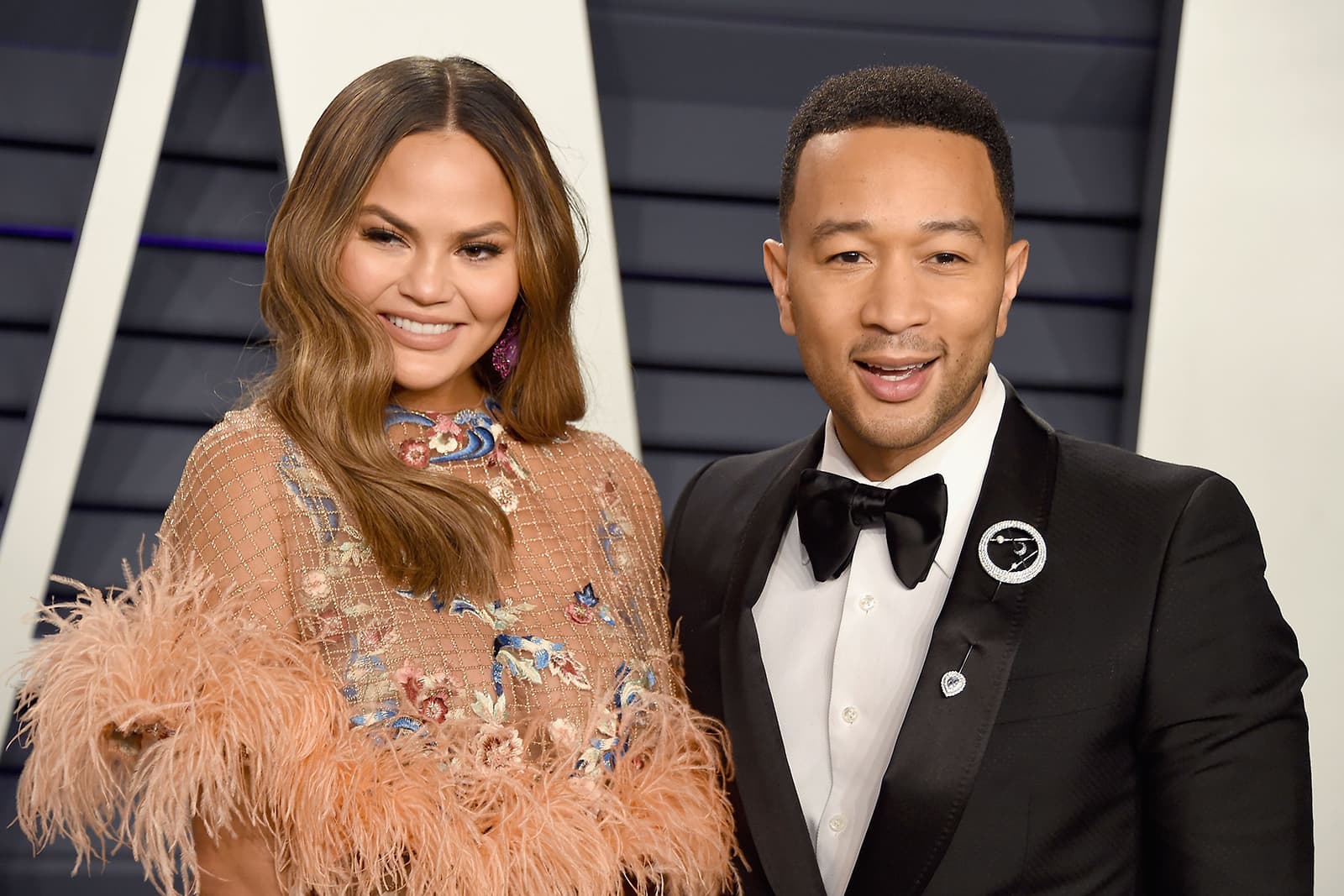  John Legend wearing Dennis T Suii ‘Galaxy’ lapel pin with diamonds and sapphires in white gold